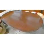 OVAL MAHOGANY TABLE WITH CROSS BANDING ON 2 COLOUMNS WITH SPREADING SUPPORTS...