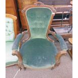 LATE 19TH/EARLY 20TH CENTURY BUTTON BACK ARMCHAIR WITH CARVED DECORATION ON TURNED SUPPORTS