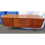 20TH CENTURY TEAK SIDEBOARD WITH 3 DRAWERS & 2 PANEL DOORS ON TURNED SUPPORTS 77CM TALL X 183CM