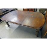 EARLY 20TH CENTURY MAHOGANY WIND-OUT DINING TABLE WITH LEAF ON TURNED SUPPORTS - TOTAL LENGTH 183