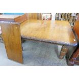 LATE 19TH/EARLY 20TH CENTURY OAK WIND OUT EXTENDING DINING TABLE WITH CARVED DECORATIVE EDGES,