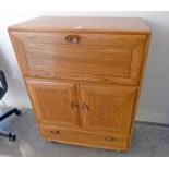 ERCOL BUREAU DESK CABINET WITH FALL FRONT OVER 2 PANEL DOORS OVER SINGLE DRAWER