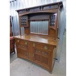 ARTS & CRAFTS OAK MIRROR BACK DRESSER DECORATED WITH CABOCHONS AND BRASS HANDLES,