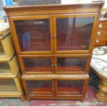 EARLY 20TH CENTURY WALNUT 3 TIER SECTIONAL BOOKCASE WITH 6 GLAZED PANEL DOORS ON TURNED SUPPORTS