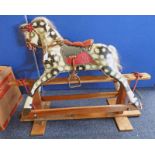 CHILDS WOODEN ROCKING HORSE WITH PAINTED DECORATION.