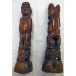 TWO LEGA CARVED BONE STANDING FIGURES OF A MALE AND FEMALE BACK TO BACK, STANDING A TOP FOUR MASKS,