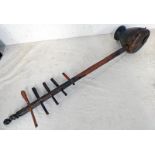 NYAMWEZI STRINGED INSTRUMENT WITH A SKIN COVERED DRUM SHAPED BASE,