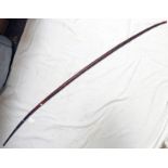 TRIBAL HARDWOOD BOW WITH ROPE BANDING Condition Report: One end of the bow has