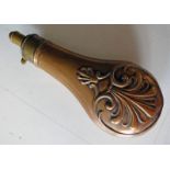 19TH CENTURY COPPER POWDER FLASK WITH EMBOSSED DECORATION. THE BRASS NOZZLE INSCRIBED G & J.W.