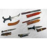 A SELECTION OF 6 AFRICAN AND OTHER DAGGERS ALL WITH LEATHER SCABBARDS -6-