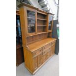 ERCOL ELM DRESSER WITH OPEN SHELVES & 2 GLAZED PANEL DOORS OVER 4 DRAWERS & 4 PANEL DOORS ON TURNED