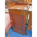 19TH CENTURY MAHOGANY CABINET WITH GALLERY TOP OVER SINGLE PANEL DOOR ON PLINTH BASE .