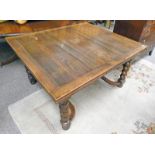 EARLY 20TH CENTURY OAK PULL-OUT TABLE ON BARLEY TWIST SUPPORTS,