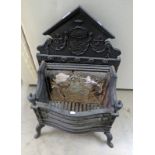 CAST IRON FIRE BASKET WITH FLORAL DECORATION,