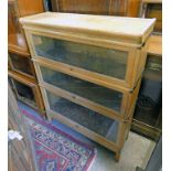 EARLY 20TH CENTURY OAK 3 TIER SECTIONAL BOOKCASE WITH 3 GLAZED PANEL LIFT UP DOORS 114 CM TALL X 86