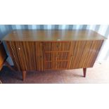 20TH CENTURY TEAK SIDEBOARD WITH 3 DRAWERS FLANKED BY A PANEL DOOR TO EACH SIDE,