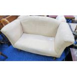 2 SEATER OVERSTUFFED SETTEE ON TURNED SUPPORTS,