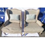A PAIR OF OAK FRAMED WINGBACK ARMCHAIRS WITH CUSHIONS Condition Report: both are in