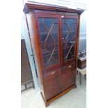 LATE 20TH CENTURY MAHOGANY BOOKCASE WITH 2 ASTRAGAL GLAZED DOORS OVER 2 DRAWERS & 2 PANEL DOORS ON