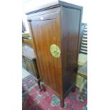 ORIENTAL CABINET WITH PANEL DOORS OPENING TO SHELVED INTERIOR,