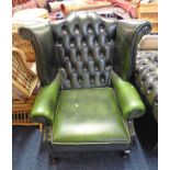 GREEN LEATHER BUTTON WING BACK ARMCHAIR