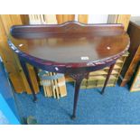 MAHOGANY HALFMOON TABLE WITH PIE CRUST DECORATION & SHAPED SUPPORTS.