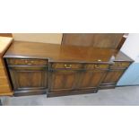 20TH CENTURY MAHOGANY SIDEBOARD WITH BREAKFRONT & 4 DRAWERS OVER 4 PANEL DOORS ON PLINTH BASE