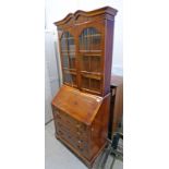 WALNUT BUREAU BOOKCASE WITH ASTRAGAL GLASS DOORS TO SHELVED INTERIOR OVER FALL FRONT BUREAU WITH 4