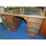 LATE 19TH CENTURY OR EARLY 20TH CENTURY OAK KNEEHOLE DESK WITH 2 COLUMNS OF 4 DRAWERS.