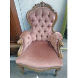 EARLY 20TH CENTURY MAHOGANY BUTTON BACK ARMCHAIR WITH CARVED DECORATION ON SHAPED SUPPORTS