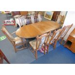 ERCOL ELM EXTENDING DINING TABLE ON TURNED SUPPORTS & SET OF 8 MATCHING ERCOL DINING CHAIRS