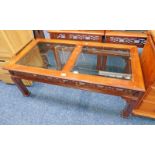 MAHOGANY COFFEE TABLE WITH CARVED DECORATION AND TWIN GLASS PANEL INSERT TOPS - 121 X 61 CM