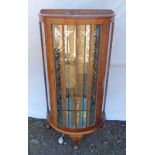20TH CENTURY BOW FRONT OCTAGONAL GLASS DISPLAY CABINET ON SHAPED SUPPORTS 116CM TALL