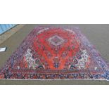 LARGE WASHED RED GROUND PERSIAN VILLAGE CARPET WITH A TRADITIONAL SHAHRUKH DESIGN 412 X 307CM