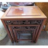 20TH CENTURY ORIENTAL HARDWOOD NEST OF 3 TABLES WITH CARVED DECORATION