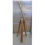 21ST CENTURY BRASS TELESCOPE ON A BRASS AND WOOD STAND