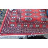 RED GROUND MIDDLE EASTERN RUG 127 X 190 CM