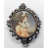 SILVER FRAMED PORTRAIT MINIATURE OF A YOUNG LADY FACING RIGHT IN A PINK DRESS,