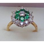 EMERALD & DIAMOND CLUSTER RING IN SETTING MARKED 18CT & PLAT Condition Report: Ring