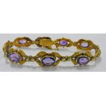 SILVER GILT BRACELET MARKED 925 SET WITH 9 OVAL AMETHYSTS