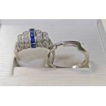 SAPPHIRE & DIAMOND CLUSTER RING THE CENTRALLY SET BAGUETTE CUT SAPPHIRES WITH 2 ROWS OF BRILLIANT