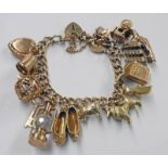 9CT GOLD CURB LINK CHARM BRACELET - TOTAL WEIGHT 49.