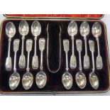 CASED SET OF 12 SILVER TEASPOONS & TONGS IN FITTED CASE,