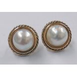 PAIR OF MABE PEARL EARCLIPS WITH A 9CT GOLD TWIST BORDER