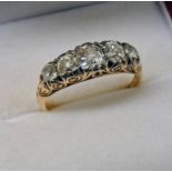 18CT GOLD 5 - STONE DIAMOND SET RING, THE CUSHION SHAPED DIAMONDS IN A SCROLL MOUNT APPROX 0.
