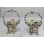 PAIR OF 19TH CENTURY CONTINENTAL WHITE METAL SALTS IN BASKET SHAPE WITH SWING HANDLES AND GLASS
