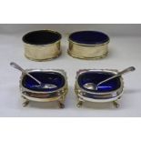 4 OVAL SILVER SALTS WITH BLUE GLASS LINERS AND 2 SILVER SPOONS