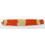 19TH / EARLY 20TH CENTURY 9 - STRAND RED & WHITE CORAL BRACELET WITH A CORAL CAMEO MOUNTED ON A