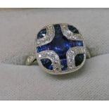 SAPPHIRE & DIAMOND SET RING, THE CENTRALLY OVAL SAPPHIRE IN A SURROUND OF SINGLE CUT DIAMONDS,