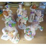 EIGHT CONTINENTAL PORCELAIN CHERUB FIGURES 12.